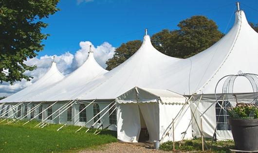 a line of sleek and modern portable toilets ready for use at an upscale corporate event in Schuyler